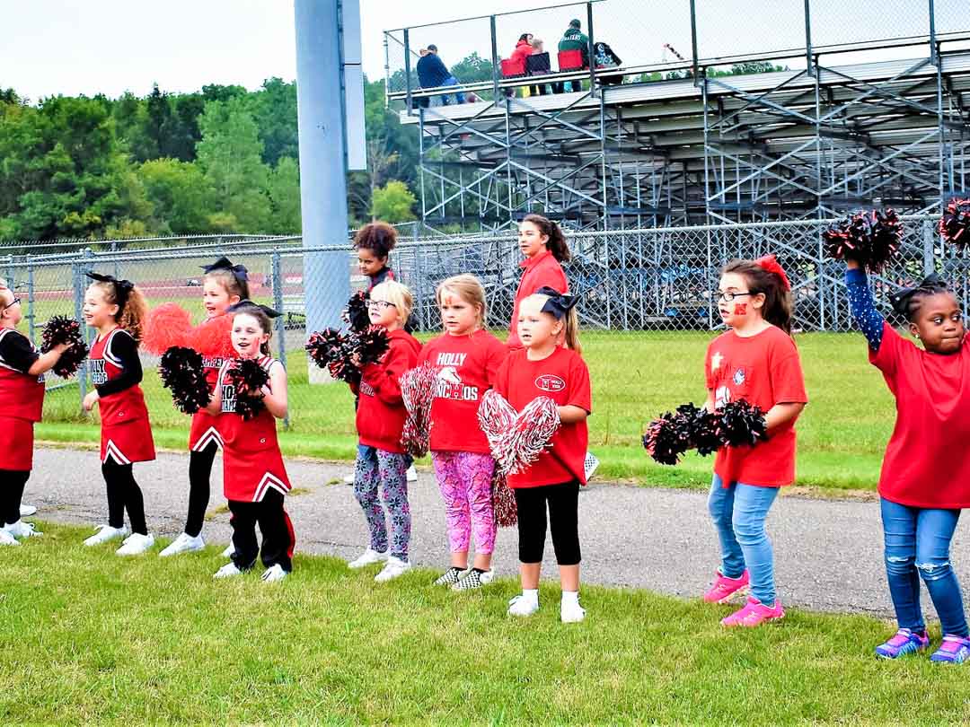 Holly Stampede Youth Cheerleaders at Football game in Holly, Michigan